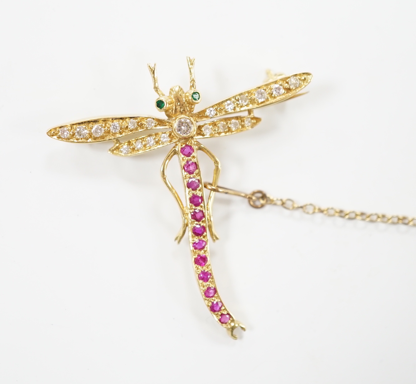 A modern 18ct gold, ruby, emerald and diamond cluster set dragonfly brooch, 40mm, gross weight 4.8 grams.